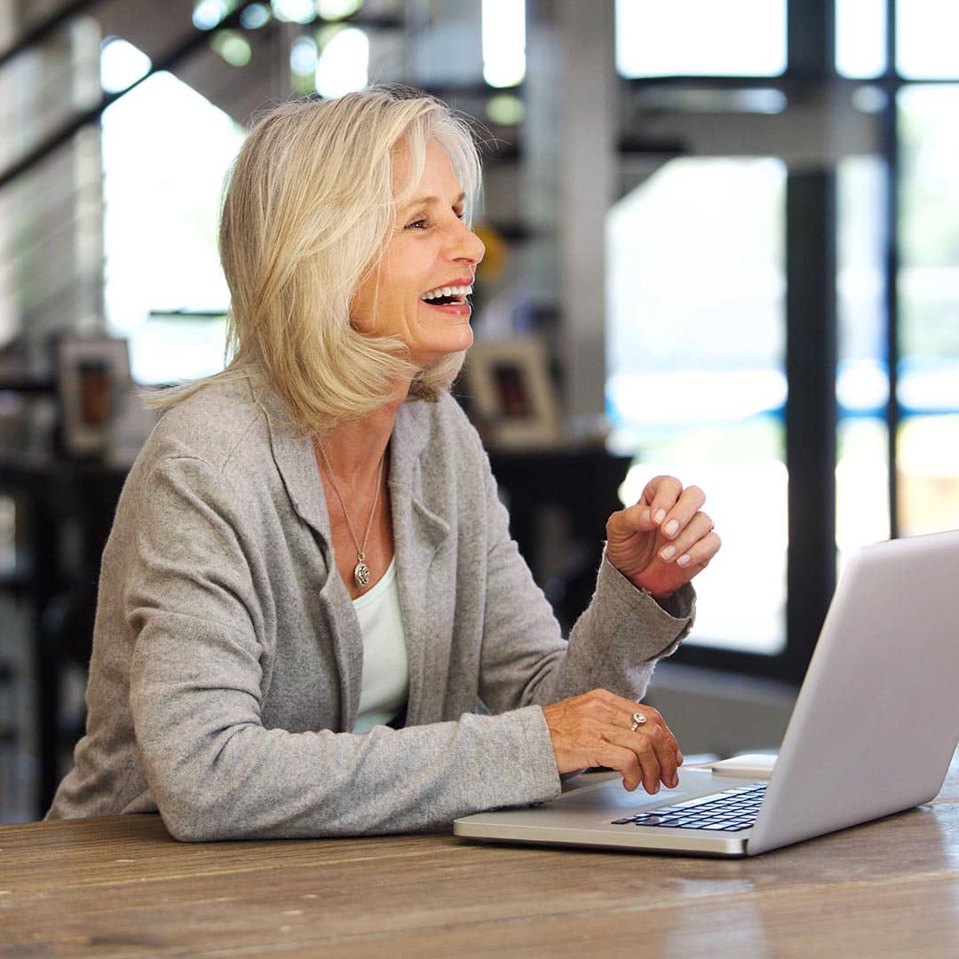 happy woman using a laptop